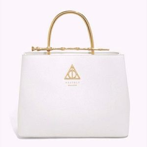 Loungefly Harry Potter Elder Wand Handbag. White and gold. New. Never used